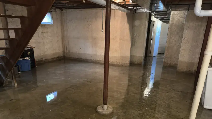 Basement and foundation stresses typical in Carlisle, Iowa — drainage, clay soils, and frost