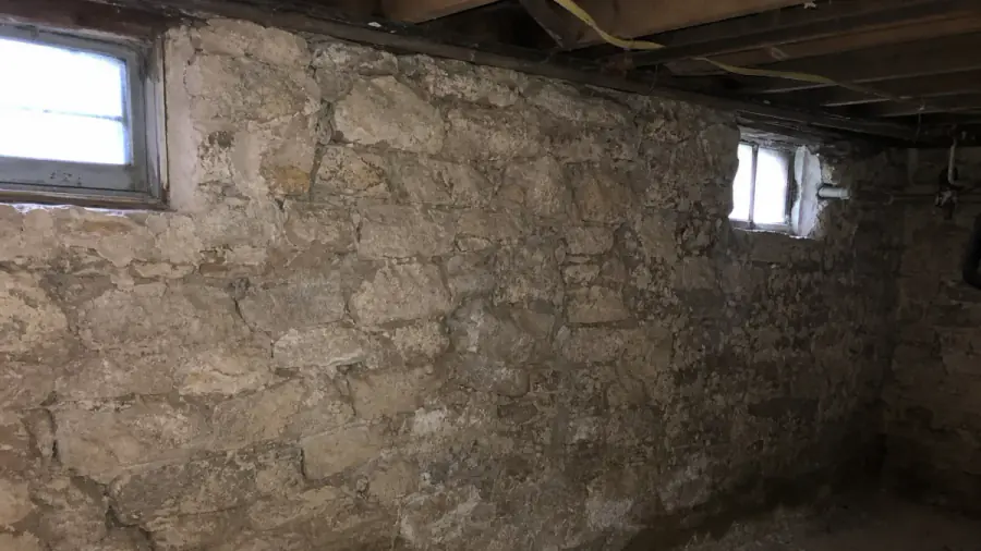 Basement and foundation stresses typical in Pella, Iowa — drainage, clay soils, and frost